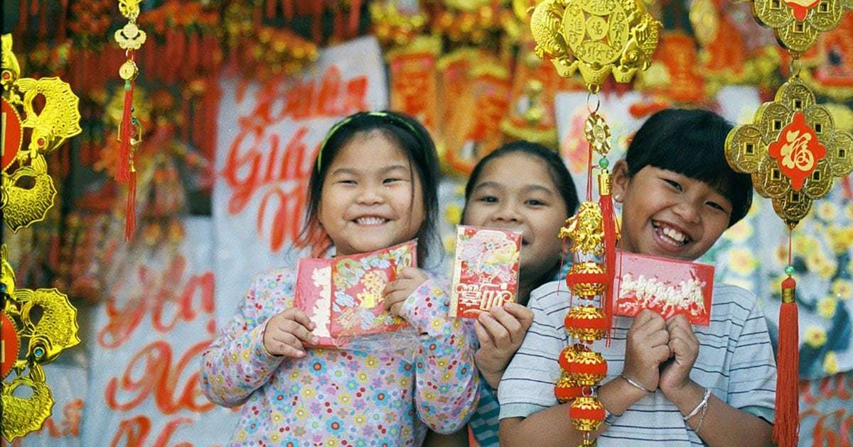 Самая популярная традиция. Праздник тет во Вьетнаме. Дети на празднике ТЭТ Вьетнам.